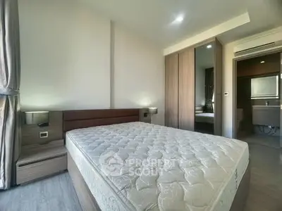 Spacious bedroom with modern design and ample natural light