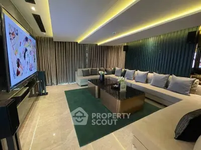 Luxurious modern living room with elegant lighting and spacious seating area.