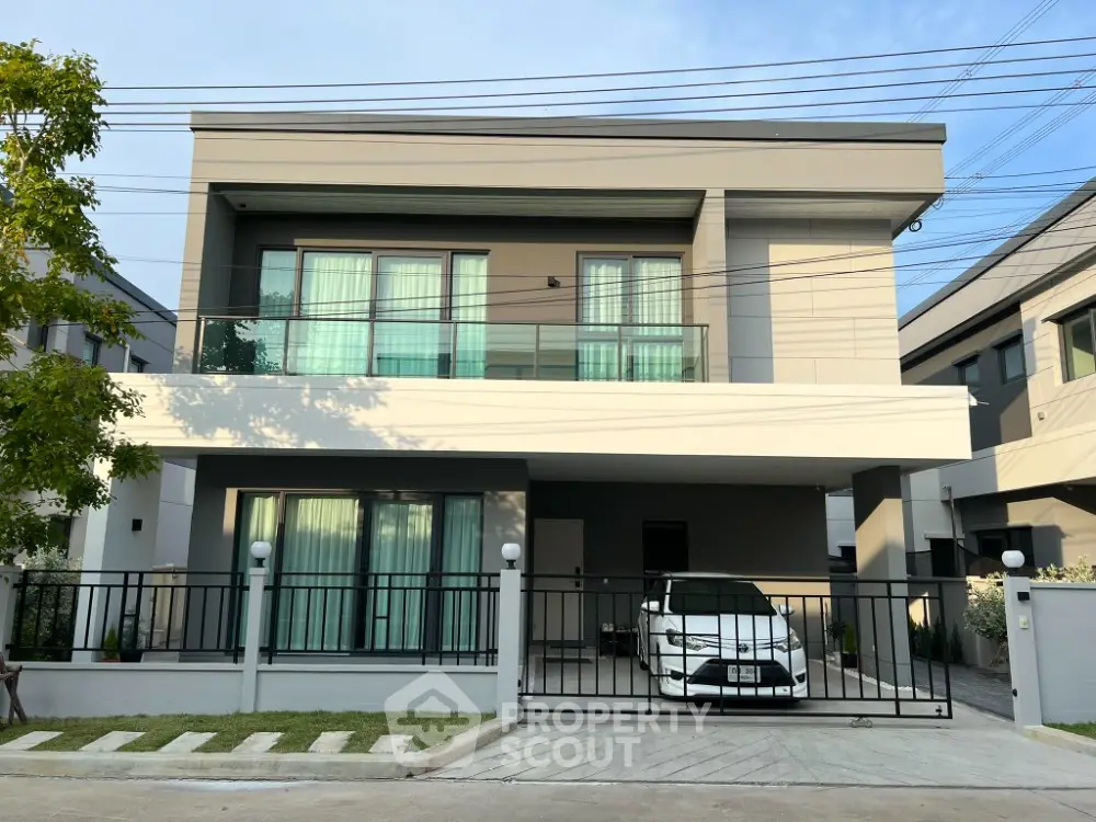Modern two-story house with sleek design and spacious driveway