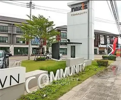 Modern community entrance with contemporary architecture and signage