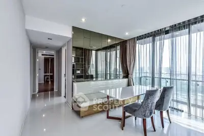 Modern living room with floor-to-ceiling windows and elegant dining area in a high-rise apartment.