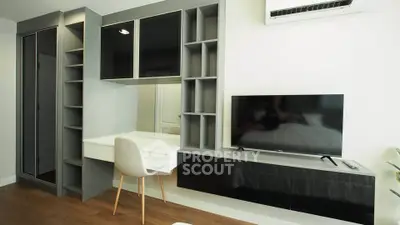 Modern living room with sleek built-in storage and TV unit