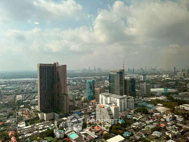 Stunning cityscape view from a high-rise building showcasing urban skyline and architecture.