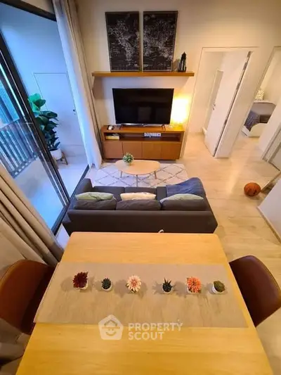 Modern living room with stylish decor and balcony view