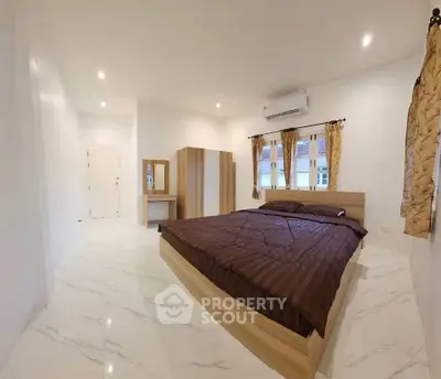 Spacious bedroom with modern design and natural light