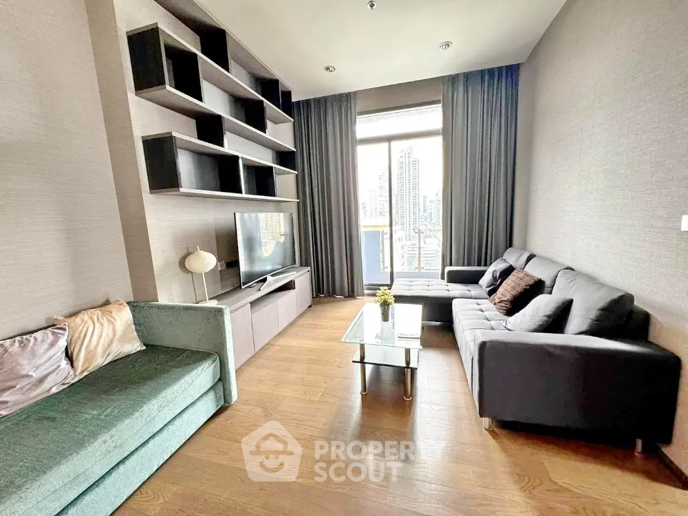 Modern living room with stylish furniture and city view from large window