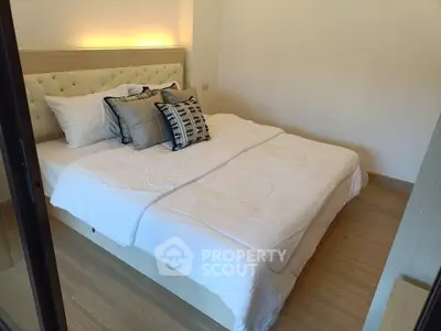 Cozy bedroom with elegant decor and soft lighting, perfect for relaxation.