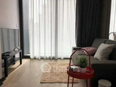 Modern living room with cozy sofa and large window