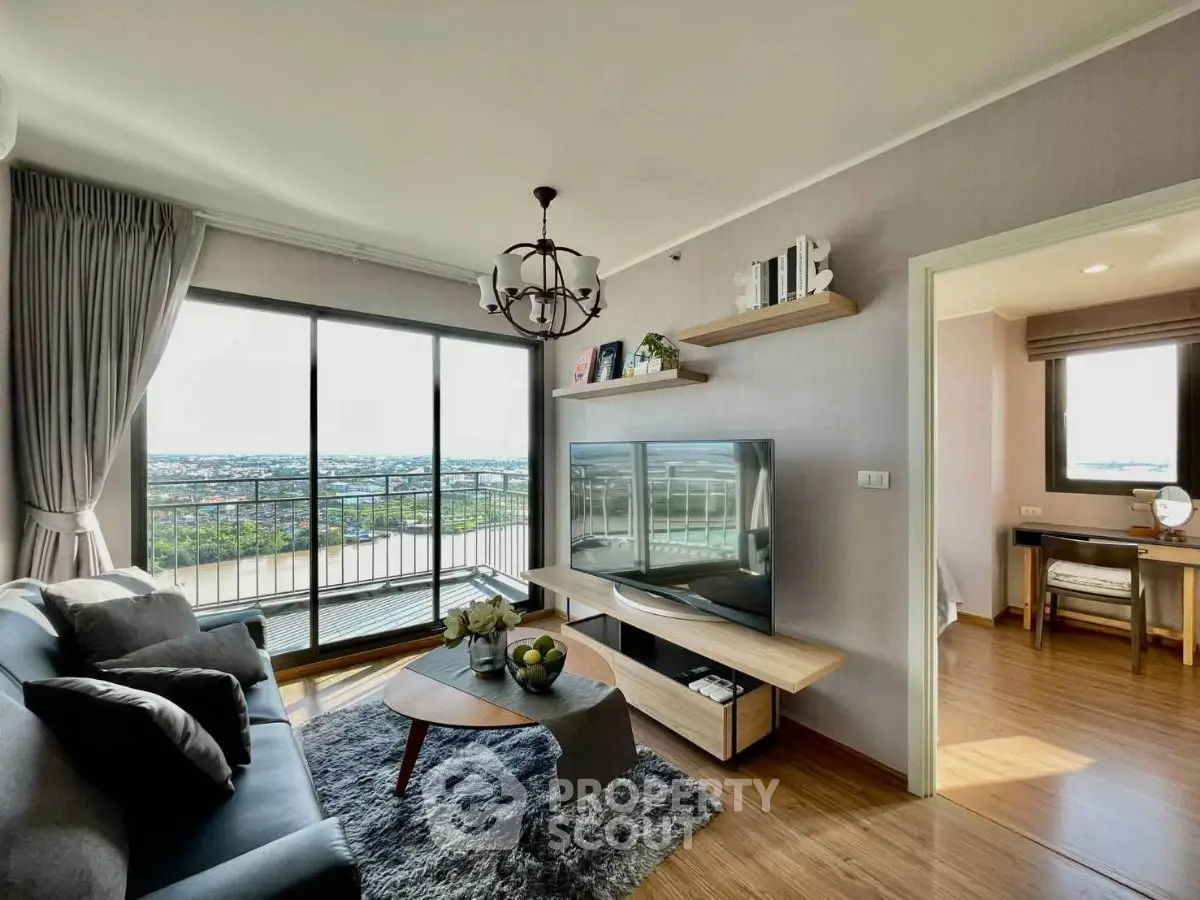 Spacious living room with modern decor and stunning balcony view