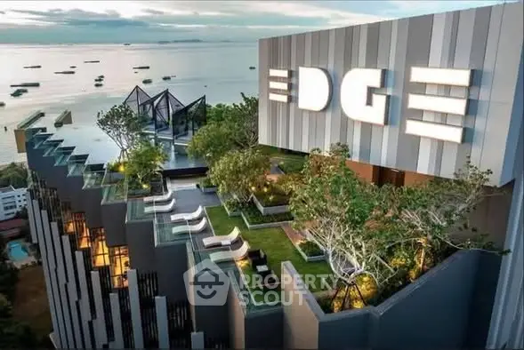 Luxurious rooftop garden with stunning ocean view at modern high-rise building.