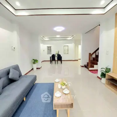 Spacious modern living room with sleek design and elegant furnishings