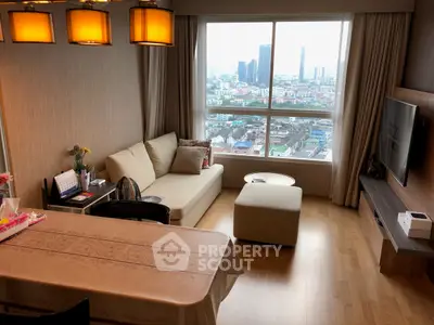 Modern living room with city view, cozy seating, and elegant lighting.