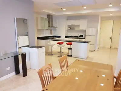 Modern open kitchen with dining area and sleek appliances