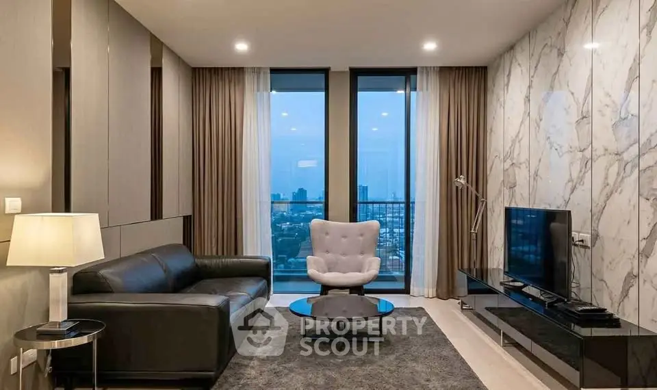 Luxurious modern living room with stunning city view, elegant marble wall, and sleek black furniture.