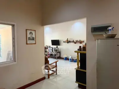 Spacious living area with modern decor and entertainment setup, ideal for family gatherings.