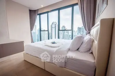 Luxurious bedroom with stunning city view and modern decor