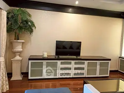 Elegant living room with modern TV stand and decorative plant