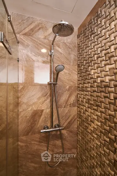 Luxurious bathroom with modern shower and textured wall design