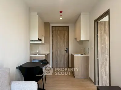 Modern apartment interior with open kitchen and cozy living area