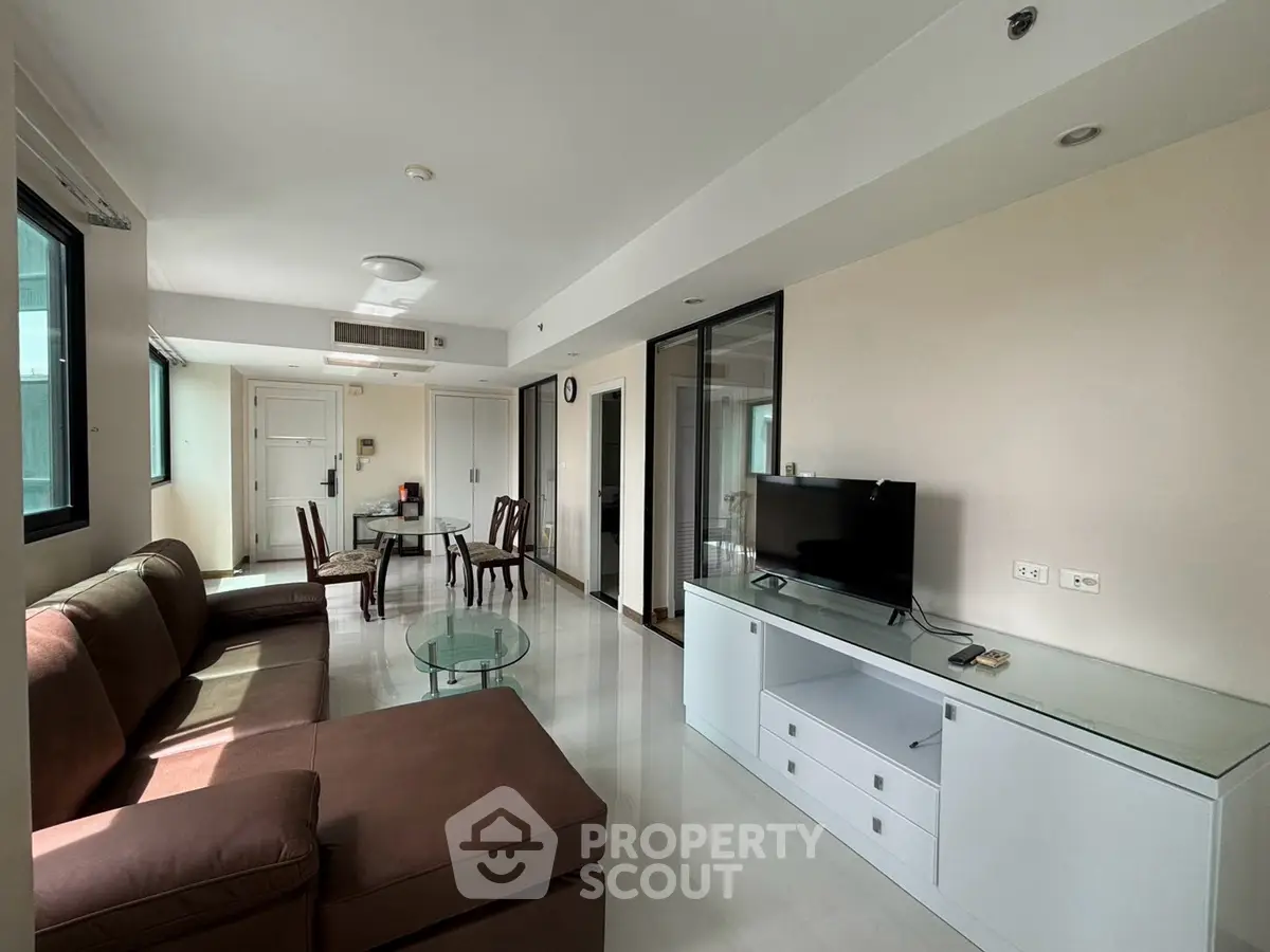 Spacious living room with modern furniture and natural light
