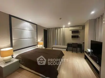 Spacious modern bedroom with elegant decor and ambient lighting