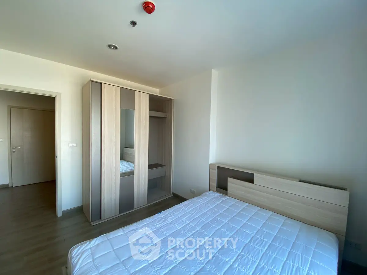 Modern bedroom with sleek wardrobe and minimalist design