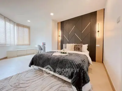 Luxurious modern bedroom with stylish decor and natural light