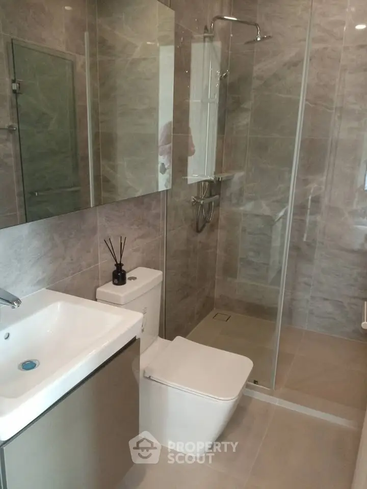 Modern bathroom with sleek design and glass shower enclosure