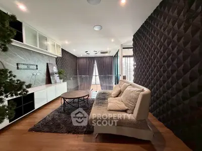 Stylish modern living room with textured walls and cozy seating area