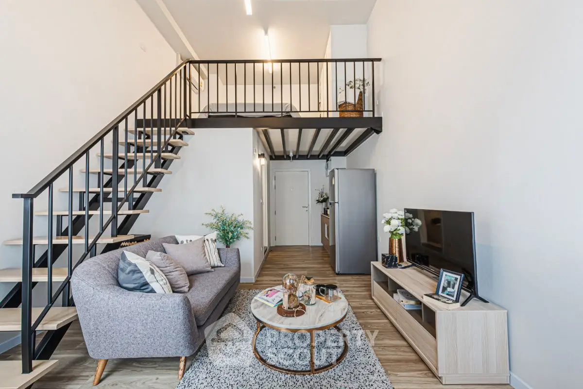 Modern loft-style living room with mezzanine and stylish decor