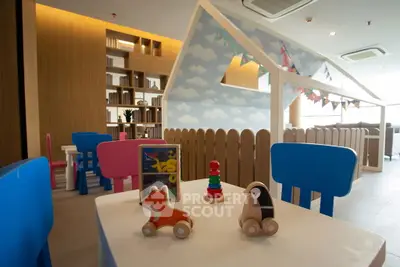 Charming children's play area with colorful furniture and playful decor in modern real estate property.