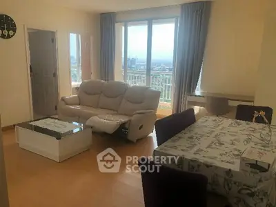 Spacious living room with city view and elegant decor