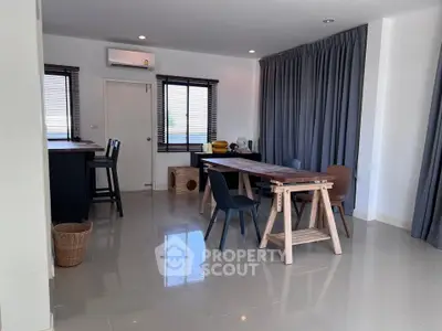 Spacious modern dining area with sleek furniture and natural light