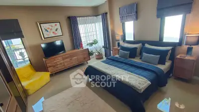 Luxurious bedroom with modern decor and ample natural light