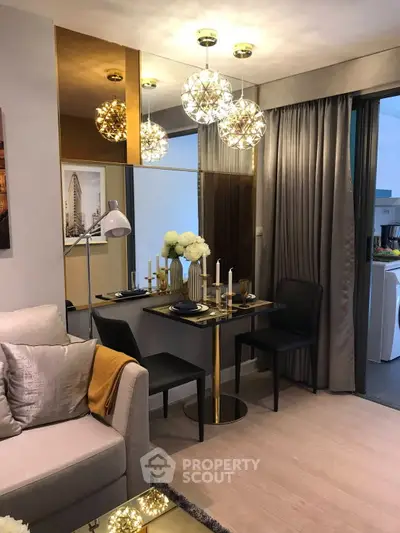 Stylish modern living room with elegant dining area and chic lighting fixtures.