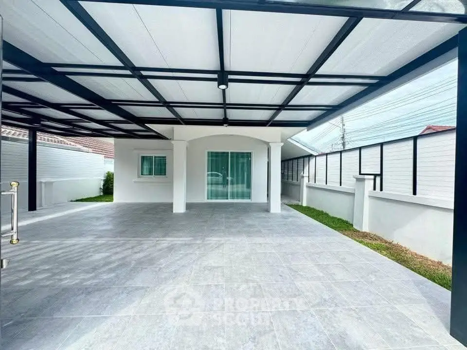 Spacious covered parking area with modern design and sleek finishes.