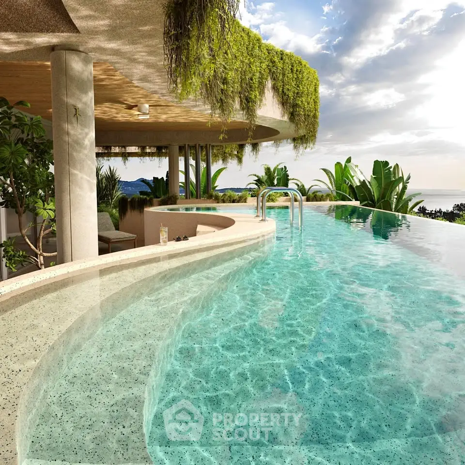 Luxurious infinity pool with lush greenery and ocean view, perfect for relaxation and leisure.