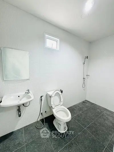 Spacious modern bathroom with sleek fixtures and minimalist design