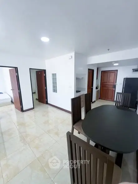 Spacious modern apartment with open dining area and sleek design