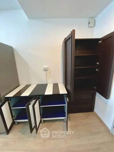 Modern storage cabinets with open doors showcasing ample shelving space in a sleek interior.