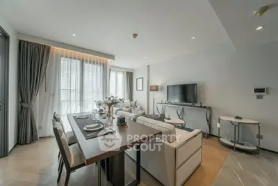 Spacious modern living room with elegant dining area and large windows