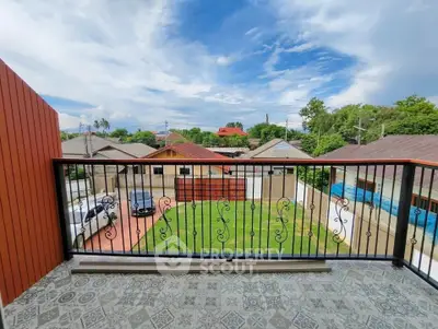 Spacious balcony with scenic view of suburban neighborhood and lush greenery.