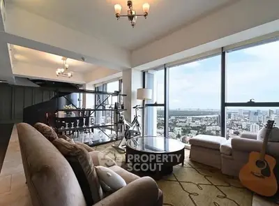 Spacious living room with panoramic city views and elegant decor.
