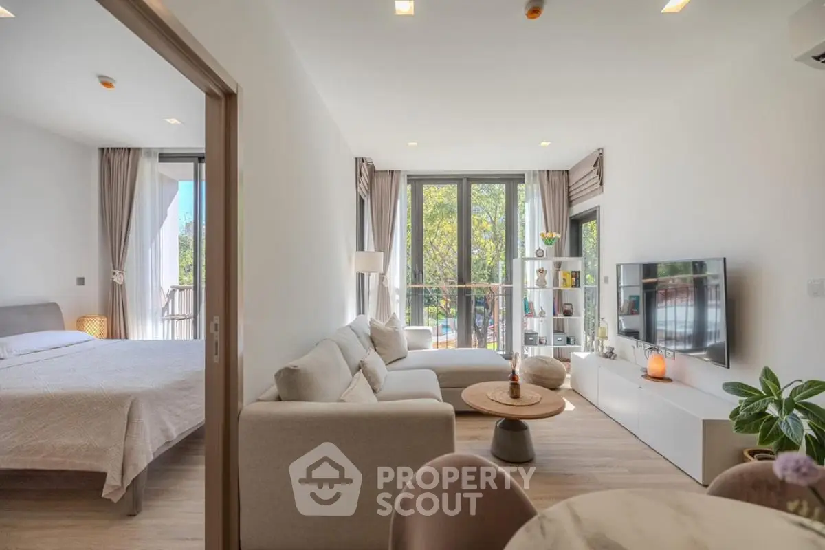 Modern open-plan living room with natural light and stylish decor