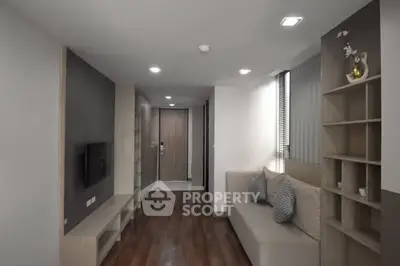 Modern living room with sleek design and cozy seating area