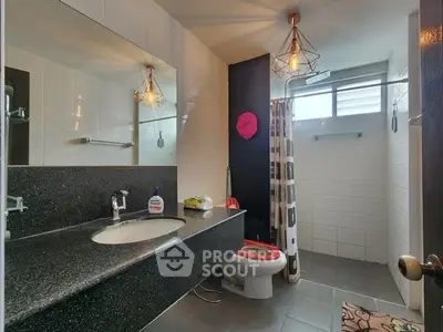 Modern bathroom with sleek fixtures and stylish lighting