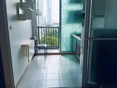 Modern kitchen with balcony view in high-rise apartment