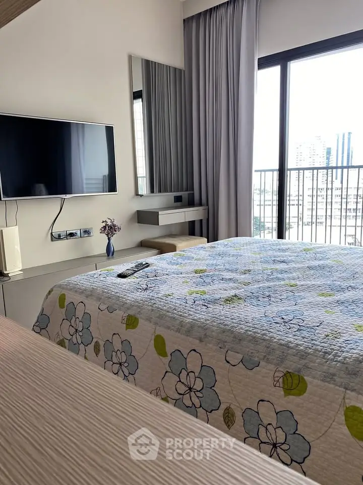 Modern bedroom with balcony view and stylish decor in urban apartment
