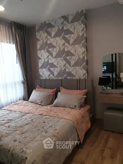 Cozy bedroom with stylish wallpaper and elegant decor