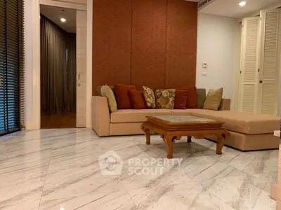 Elegant living room with marble flooring and stylish sofa set